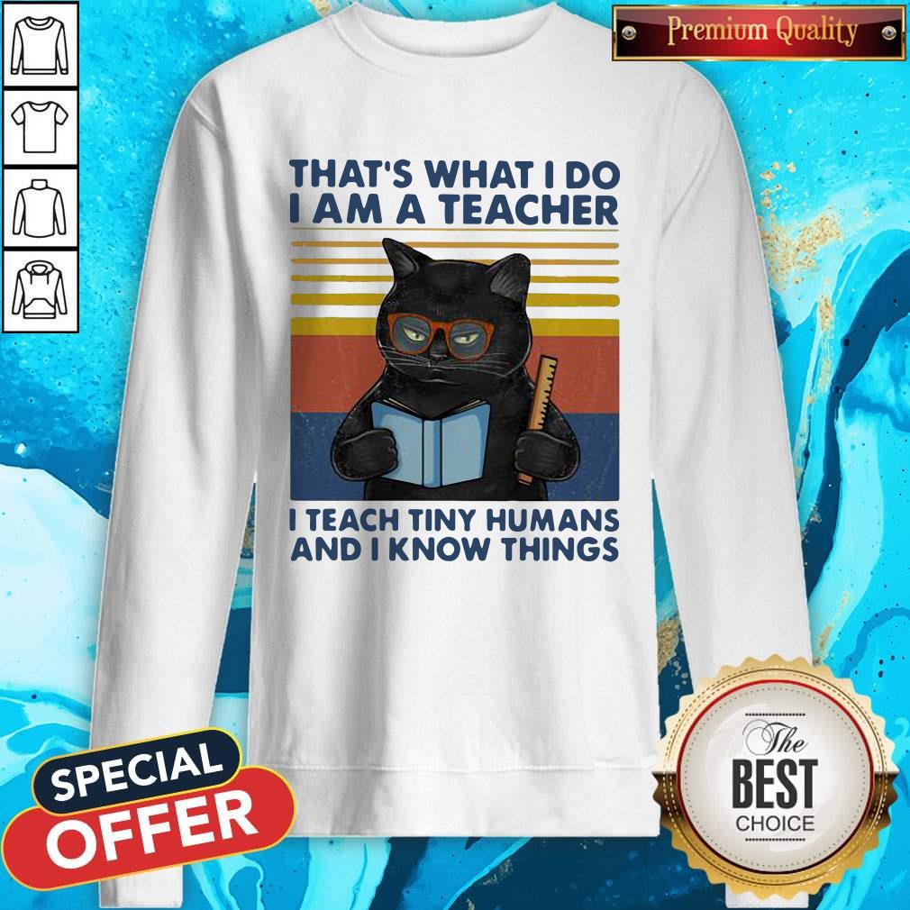 Lovely Cat That’s What I Do I’m A Teacher I Teach Tiny Humans And I Know Things Vintage Retro Sweatshirt