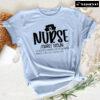 Nurse A Scrub Wearing Coffee Drinking Miracle Worker Who Helps Save Lives T-Shirt