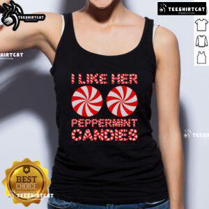 Couple in matching 'I Like Her Peppermint Candies' tank tops, celebrating Christmas with festive cheer and holiday spirit.