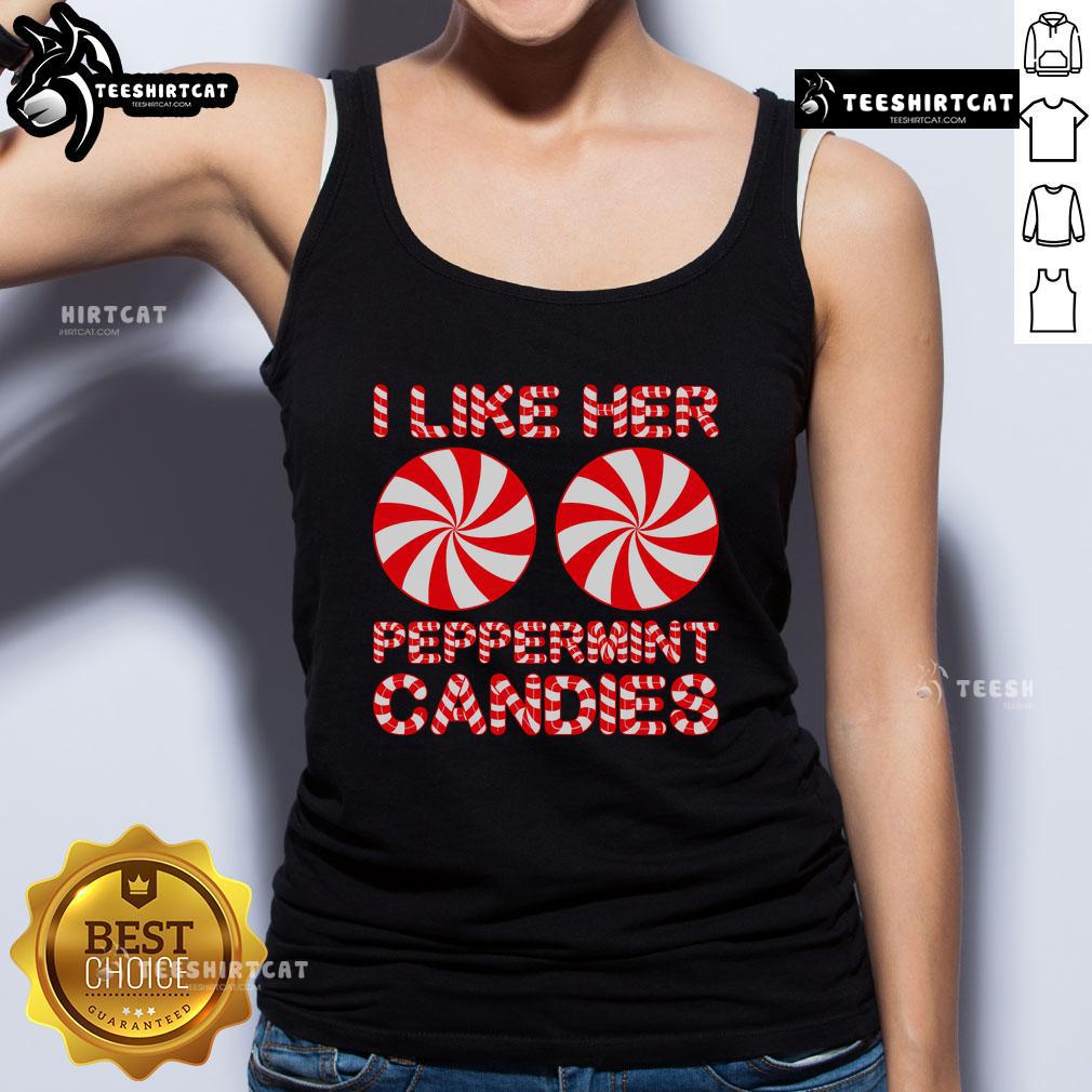 Couple in matching 'I Like Her Peppermint Candies' tank tops, celebrating Christmas with festive cheer and holiday spirit.