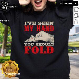 Card player wearing a 'Nice I've Seen My Hand' sweatshirt at a casino, showcasing poker flair and style.