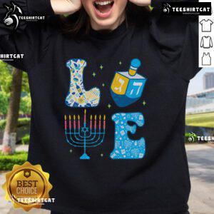 Alt Text: Cute Hanukkah sweatshirt featuring a colorful dreidel and menorah design for the Jewish holiday celebration.