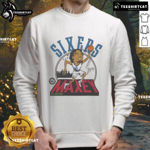 Alt Text: Official 76ers Tyrese Maxey signature sweatshirt featuring team colors and logo, perfect for fans and players.