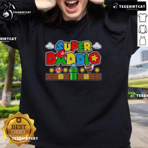 Pretty Super Daddio Dad in a Super Mario sweatshirt, enjoying video gaming with a joyful smile.