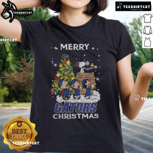 Florida Gators X Snoopy and Friends Merry Christmas 2024 Ladies Tee featuring festive graphics and vibrant colors.