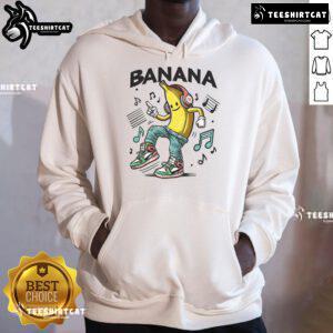 Person wearing a Funny Dance Like A Banana Hoodie, showcasing a playful dance move in a vibrant setting.