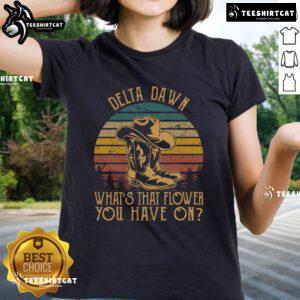 Vintage sunset ladies tee with cowboy boots and flower design, titled 'Nice Delta Dawns What's That Flower.'