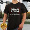 Nice Grab 2024 By The Pussy T-Shirt featuring bold graphic design and vibrant colors for a stylish statement.