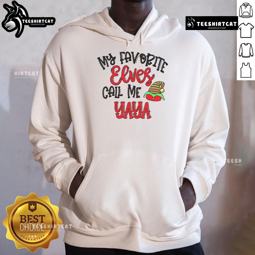 Cozy 'Nice My Favorite Elves Call Me Yaya' hoodie displayed on a rustic wooden background, perfect for holiday wear.