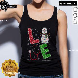 Cheerful nurse wearing a Christmas-themed tank top at physical therapy in a snowy setting, celebrating the holiday spirit.