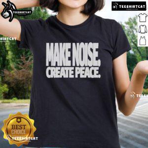 Official Make Noise Create Peace Ladies Tee showcasing a stylish design with a positive message for women's fashion.