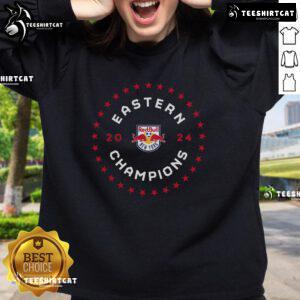 Official New York Red Bulls 2024 MLS Eastern Conference Champions sweatshirt displayed in a locker room setting.