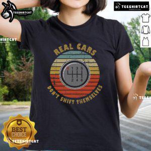 Vintage ladies tee featuring 'Official Real Cars Dont Shift Themselves' slogan, perfect for manual transmission enthusiasts.