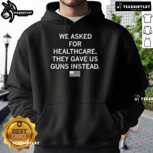 Official We Asked For Healthcare They Gave Us Guns Instead Hoodie showcasing a bold statement on social issues.