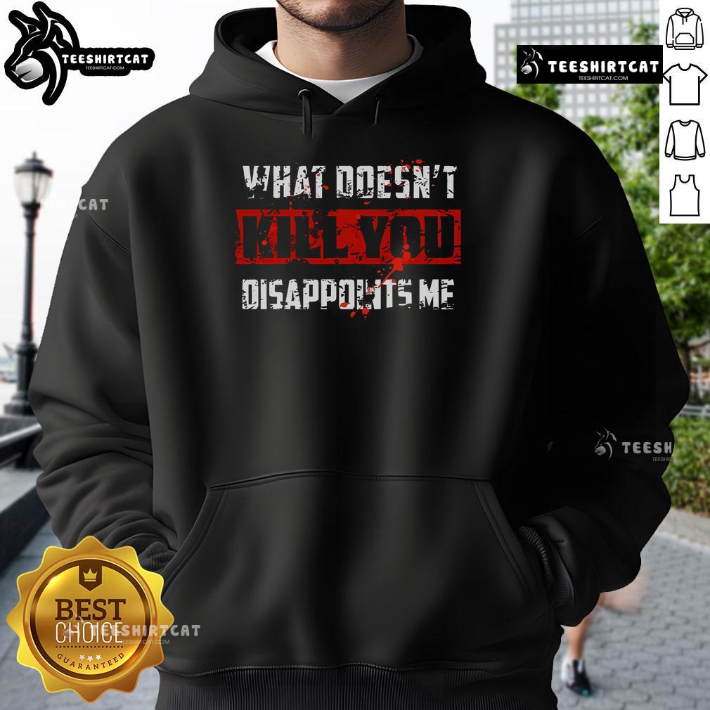 Official What Doesn't Kill You Disappoints Me Hoodie displayed on a hanger, showcasing its unique design and vibrant colors.