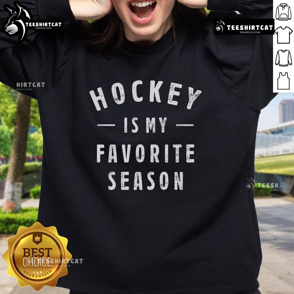 Alt Text: Premium hockey sweatshirt featuring 'Hockey Is My Favorite Season' slogan, perfect for sports lovers.