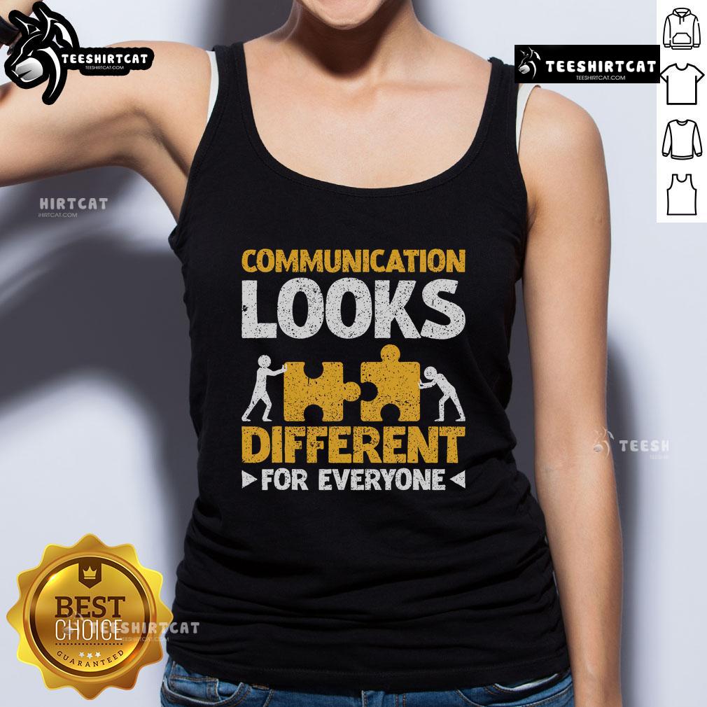 Autism teacher wearing a tank top with 'Communication Looks Different for Everyone' slogan, promoting inclusivity and awareness.