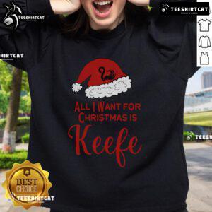 Alt Text: Cozy Pretty Christmas sweatshirt for Keeper fans of the Lost Cities, featuring festive designs and vibrant colors.