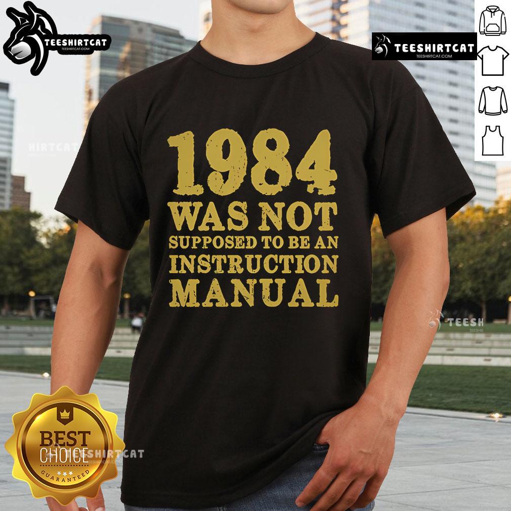 Top 1984 Was Not Supposed To Be An Instruction Manual T-Shirt design featuring bold text and a stylish graphic.