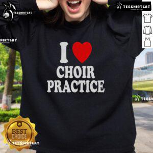 Alt Text: Cozy I Heart Love Choir Practice sweatshirt worn by singers during a lively chorus rehearsal.