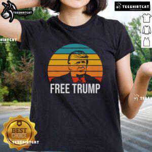 Awesome Free Donald Trump Retro Sunset Ladies Tee featuring a vibrant sunset design and stylish lettering.