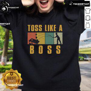 Funny cornhole toss like a boss retro sweatshirt design featuring vibrant graphics and playful typography.