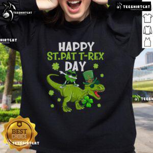Alt Text: Happy St. Pat's T-Rex wearing a shamrock on a green sweatshirt for St. Patrick's Day celebration.