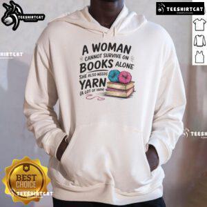 Cozy hoodie featuring 'A Woman Cannot Survive On Books Alone She Also Needs Yarn' design, perfect for book and yarn lovers.