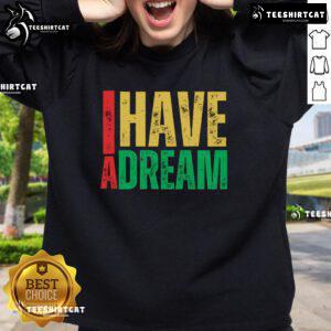 Cozy 'I Have A Dream' sweatshirt featuring Martin Luther King Jr. Day design, promoting strength and love.