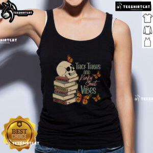 Model wearing a 'Nice Thick Thighs and Kinky Smut Vibes' tank top, showcasing a trendy and playful fashion statement.
