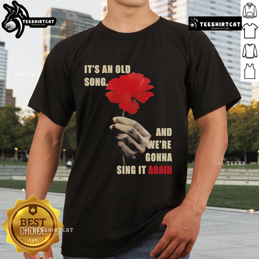 Official Hadestown 'It's An Old Song And We're Gonna Sing It Again' T-Shirt featuring vibrant design and lyrics.