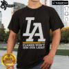 Official La Dream Flames Won't Dim Our Light T-Shirt featuring vibrant flame design and empowering message.
