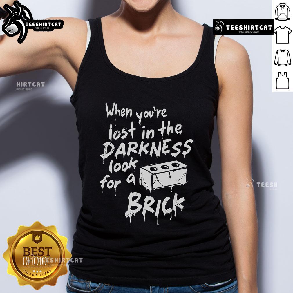 Official When You're Lost in the Darkness Look for a Brick Tank Top design featuring bold text on a stylish tank top.