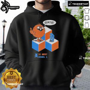 Alt Text: Top DJ Qbert wearing a Round 1 X Morning Breath Club hoodie, showcasing stylish streetwear and vibrant urban culture.