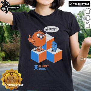 Top DJ Qbert Round 1 X Morning Breath Club ladies tee featuring vibrant graphic design and stylish fit for music fans.