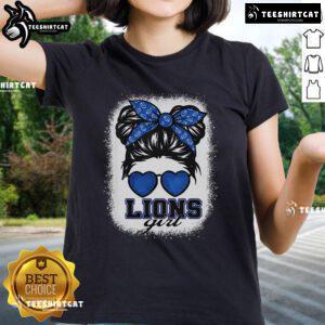 Girl wearing a Top Retro Lions tee with a messy bun hairstyle, showcasing trendy casual style for ladies.