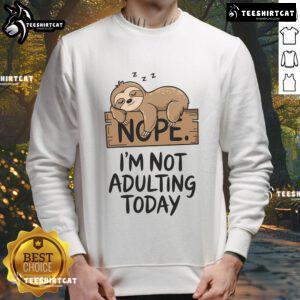 Alt Text: Cute sloth graphic on a comfy sweatshirt, perfect for lounging with the phrase Nope, I'm not adulting today.