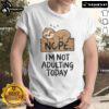 Alt Text: Cute sloth graphic on a t-shirt with text 'Nope, I'm Not Adulting Today' perfect for sloth lovers.