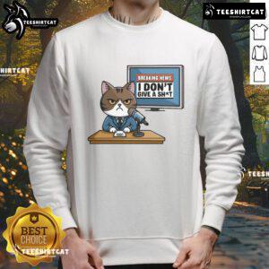 Alt Text: Funny Breaking News I Don't Give A Shit Angry Cat Sweatshirt design featuring a grumpy cat graphic.