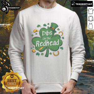Funny Irish St. Patrick's Day sweatshirt featuring 'Dibs on the Redhead' design with clovers, perfect for festive celebrations.