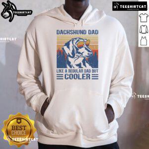 Funny vintage Dachshund hoodie with text: 'Dad like a regular dad but cooler' showcasing a playful dog design.