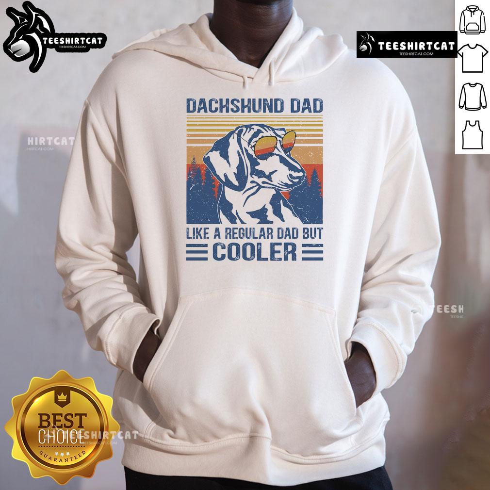 Funny vintage Dachshund hoodie with text: 'Dad like a regular dad but cooler' showcasing a playful dog design.
