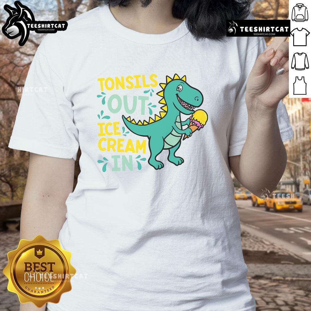Lady wearing a Dino tee enjoying ice cream after tonsil removal, showcasing a fun and whimsical recovery moment.