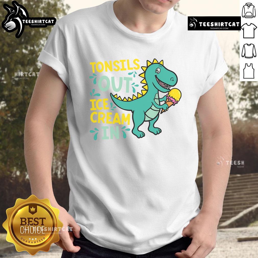 Child wearing a Dino T-shirt enjoying ice cream after tonsil removal, showcasing a fun and cheerful recovery moment.