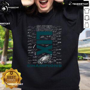 Hot Philadelphia Eagles Super Bowl LIX Champions roster autograph signing sweatshirt displayed on a wooden background.