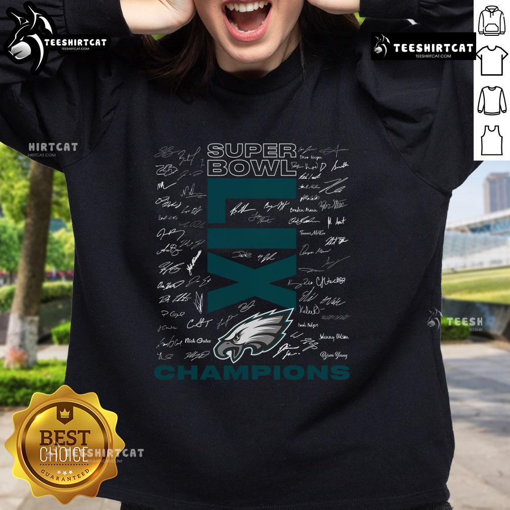 Hot Philadelphia Eagles Super Bowl LIX Champions roster autograph signing sweatshirt displayed on a wooden background.