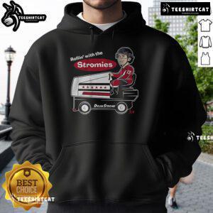 Nice Dylan Strome wearing a stylish 'Rollin with the Stromies' hoodie, showcasing team spirit and fashion.