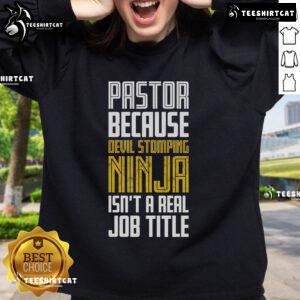 Alt Text: Funny sweatshirt with 'Nice Pastor, Devil Stomping Ninja Isn't A Real Job Title' slogan, perfect for humor lovers.