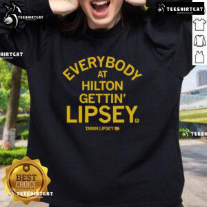 Group at Hilton wearing Tamin Lipsey sweatshirt, showcasing unity and style at the Official Everybody event.