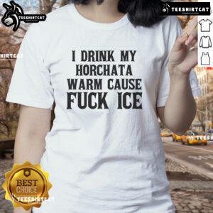 Womens tee featuring 'I Drink My Horchata Warm Cause F* Ice' slogan for deportation protest, promoting social justice.
